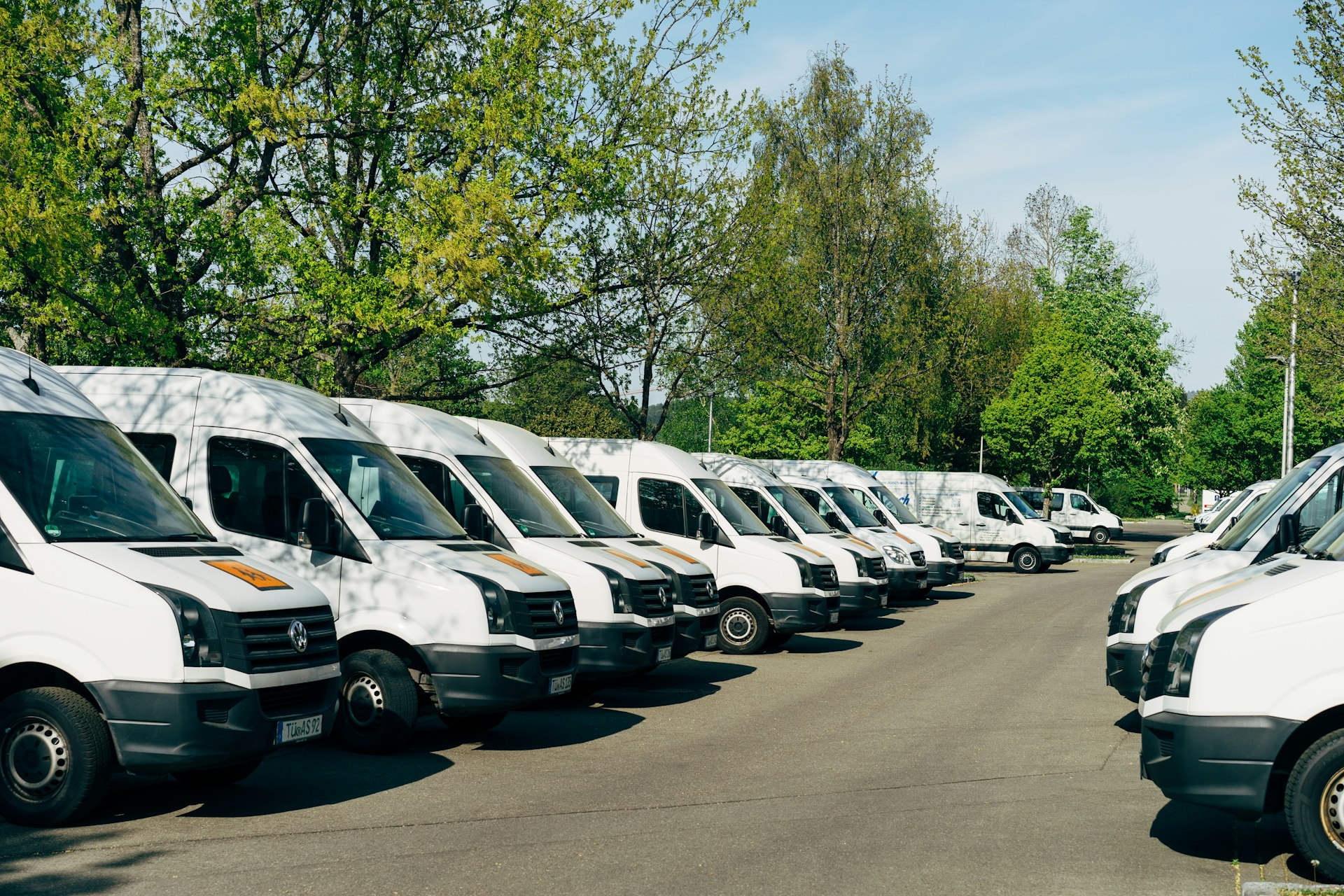 A row of work vans parked together